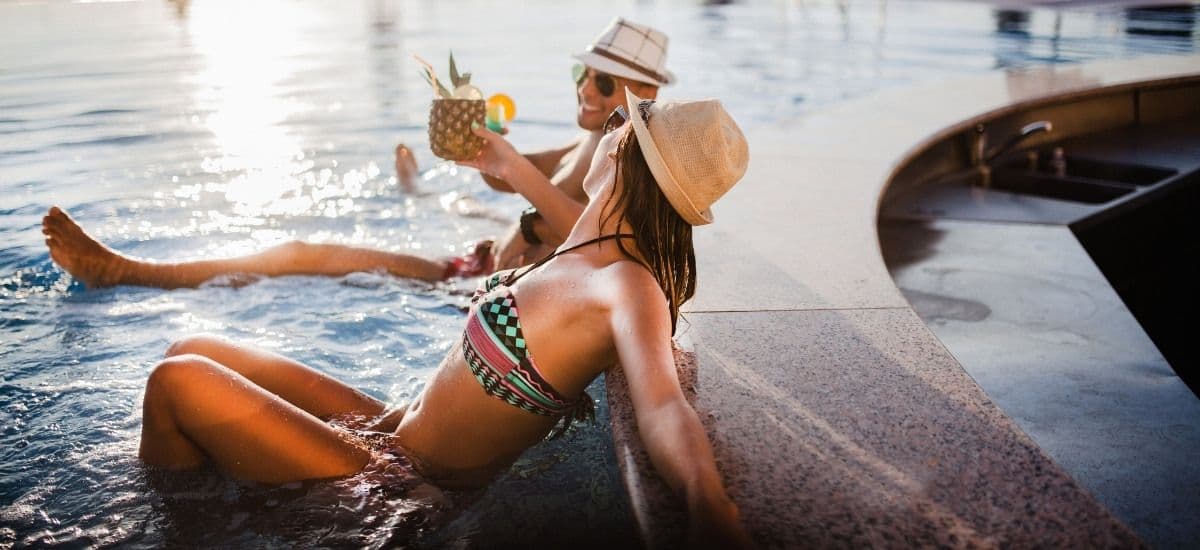 couple enjoying the pool at a luxury resort