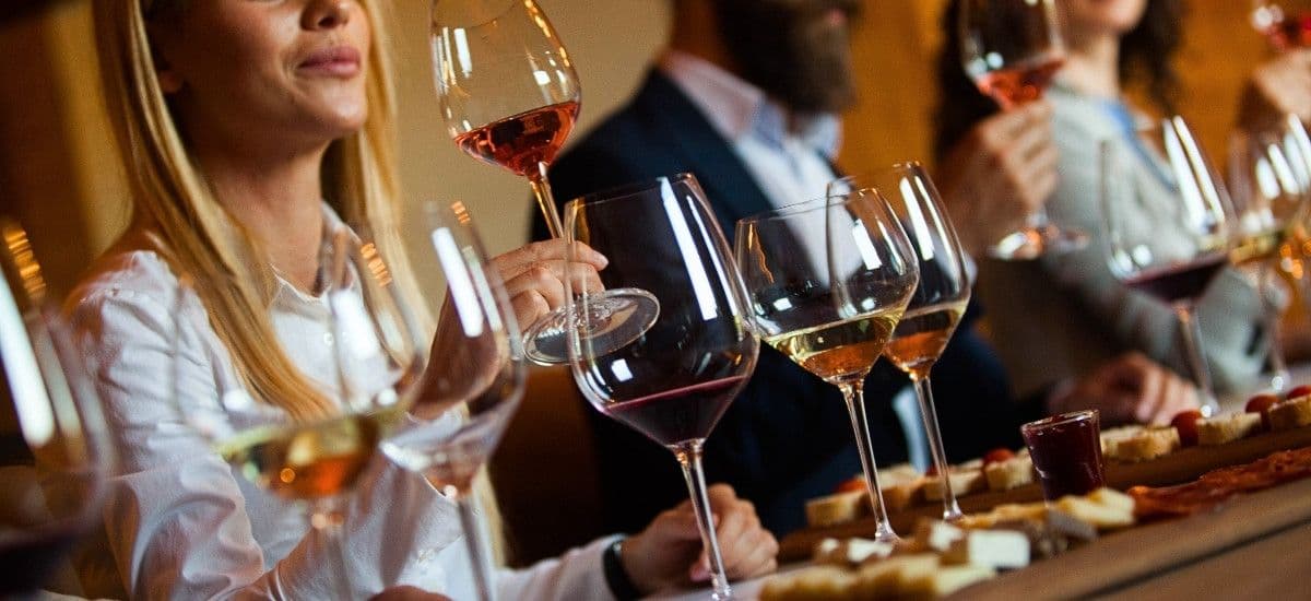 wine tasting at a luxury winery ith flights of wine poured