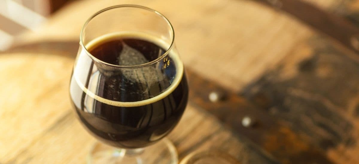 dark beer stout style poured in glass