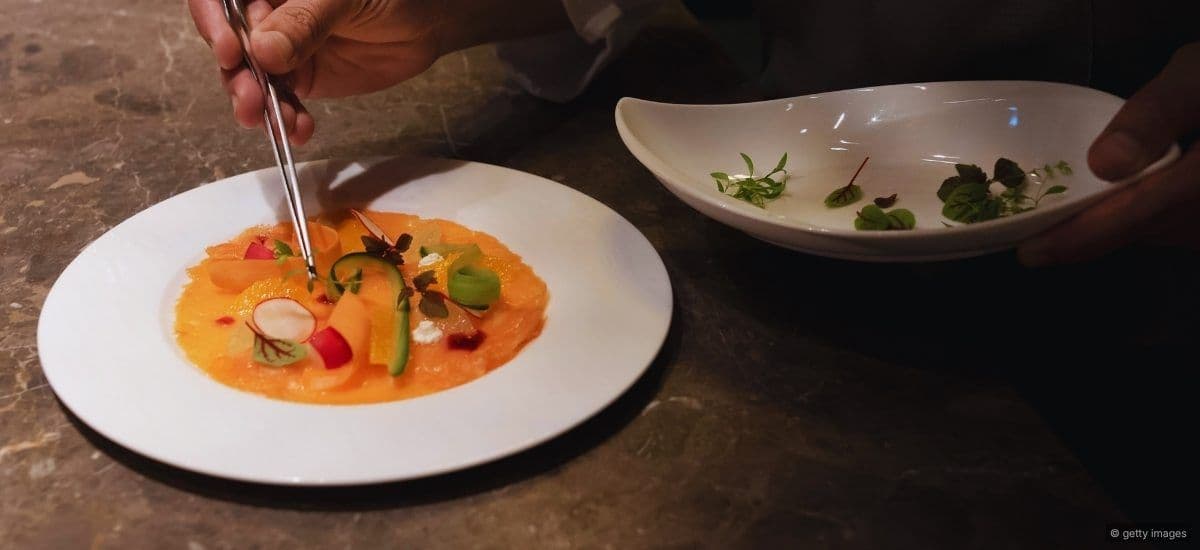 chef preparing intricate dishes on the line in a restaurant
