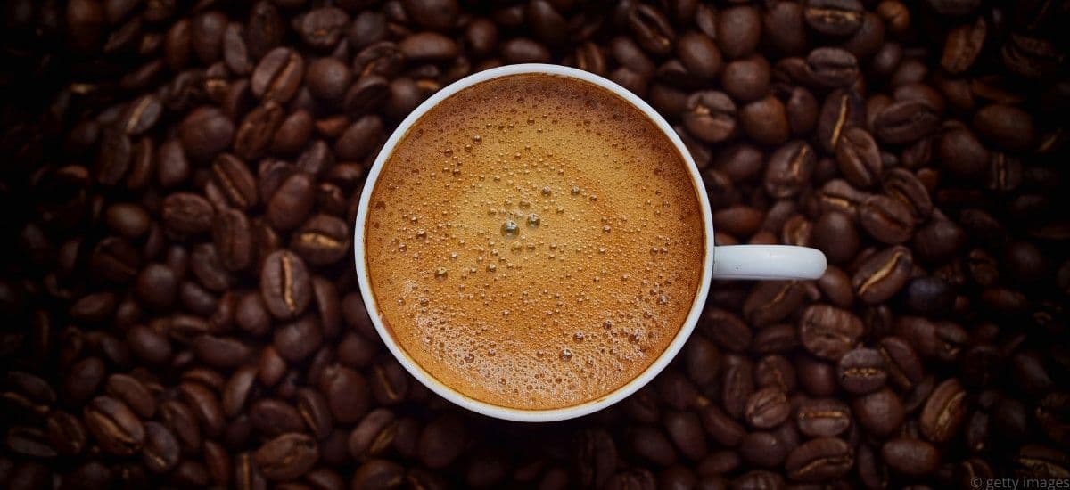 a smooth cup of coffee and coffee beans