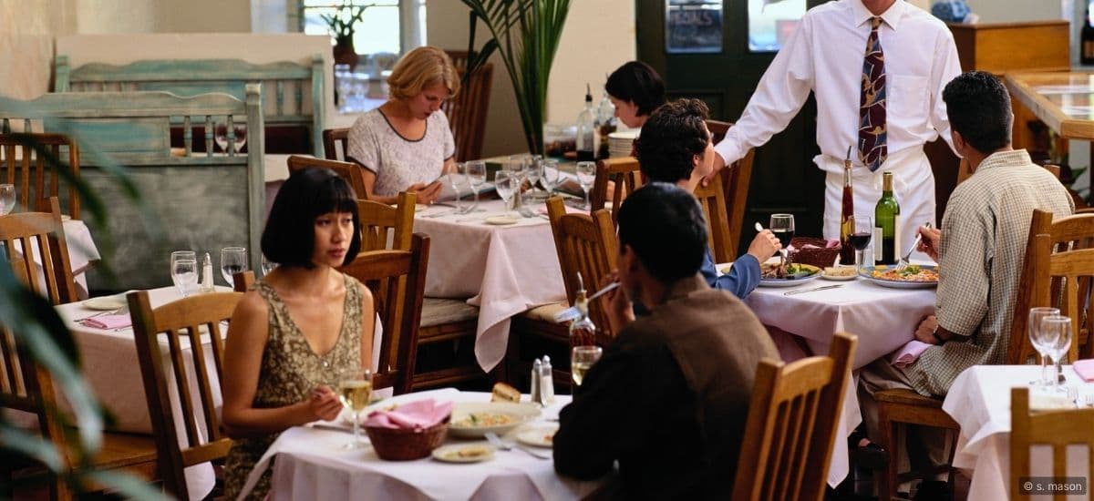 restaurant scene with diners enjoying the evening