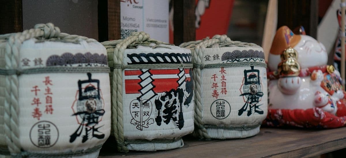 traditional sake barrels at a kura or sake brewery
