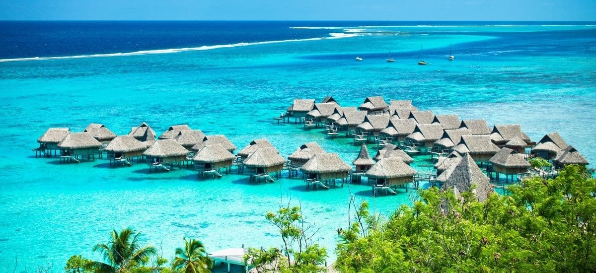 luxury hotel in the islands with its chain of huts extending over the water